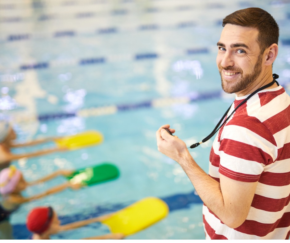 swimming-instructor-with-group-of children