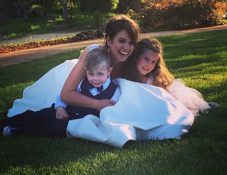 Professional wedding childcare with children enjoying supervised activities during a reception